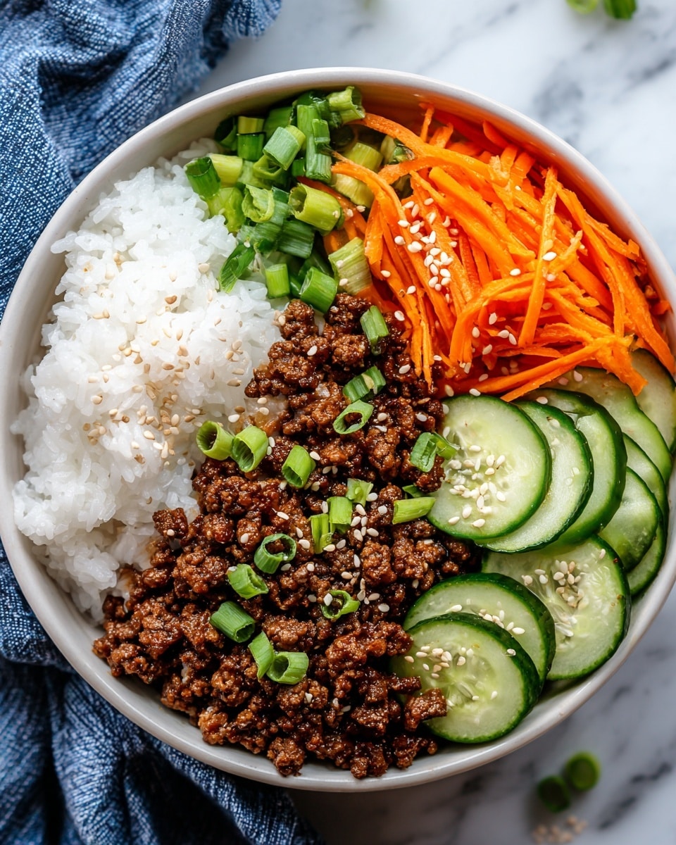 A bowl of food with four distinct layers arranged in separate sections: on the bottom right is a fluffy white rice base, topped slightly with small green onion pieces; next to the rice, on the upper right, is a bright orange shredded carrot layer with black pepper and white sesame seeds sprinkled on top; in the center sits a mound of dark brown cooked ground meat garnished with chopped green onions and white sesame seeds; on the left side, there are thin, overlapping slices of green cucumber sprinkled with sesame seeds. The bowl is light gray and placed on a white marbled texture surface. Photo taken with an iphone --ar 4:5 --v 7
