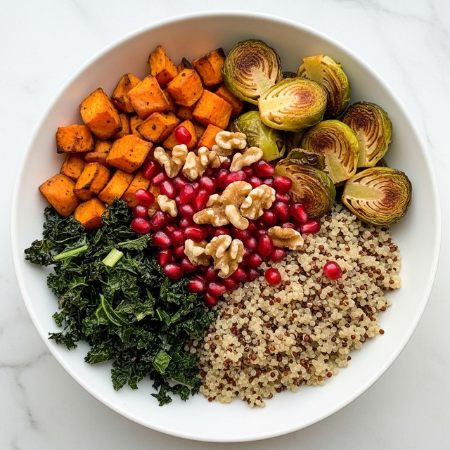 A white bowl sits on a white marbled surface, filled with a colorful layered dish. The bottom layer is a mix of cooked quinoa in light beige and darker brown shades. On top, there are roasted orange sweet potato cubes on the left side and crispy green kale pieces at bottom left. On the right side, golden-brown roasted Brussels sprouts halves are arranged. In the center, bright red pomegranate seeds and walnut pieces are piled, adding vibrant colors and textures to the dish. photo taken with an iphone --ar 4:5 --v 7