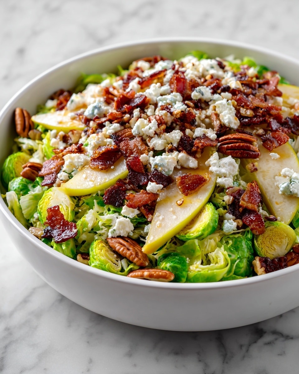 A white bowl filled with a layered salad starting with shredded and halved bright green Brussels sprouts as the base. On top, there are thin strips of crispy dark brown bacon scattered throughout. Light yellow pear slices with their skin on are arranged evenly across the salad, bringing a smooth, juicy texture. Small chunks of white feta cheese are sprinkled all over, adding contrast. Finally, whole pecan nuts with a rich brown color sit on top for a crunchy finish. The salad is drizzled with a glossy yellowish dressing. The bowl rests on a white marbled texture. photo taken with an iphone --ar 4:5 --v 7