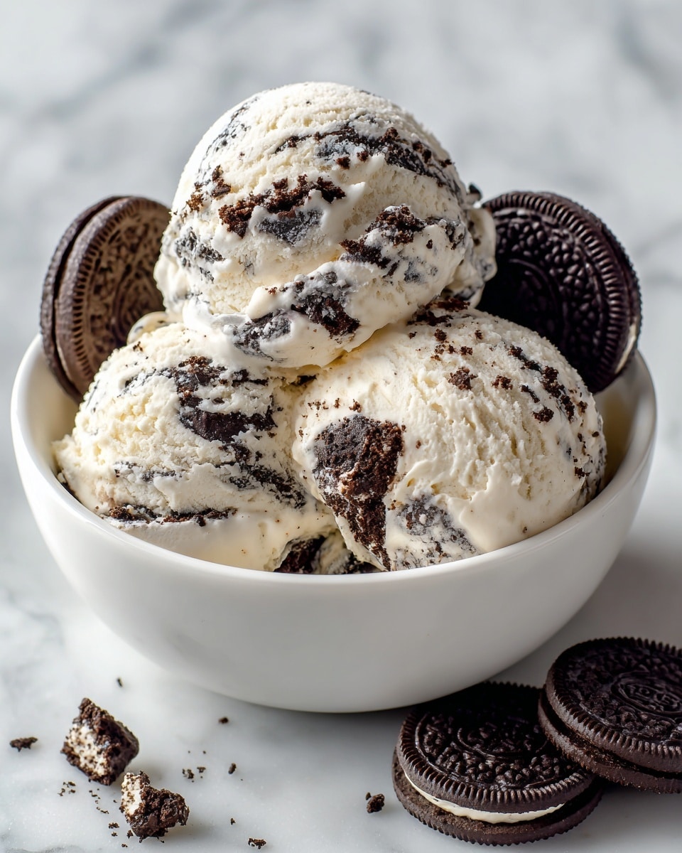 A white round bowl filled with three large scoops of cookies and cream ice cream, each scoop showing creamy white ice cream mixed with chunks of dark chocolate cookies. One scoop is at the top center, and two scoops are underneath on the sides, with extra cookie pieces visible inside the ice cream. Two whole dark chocolate sandwich cookies are placed on the right side inside the bowl, and two more cookies rest outside the bowl on the white marbled surface. photo taken with an iphone --ar 4:5 --v 7
