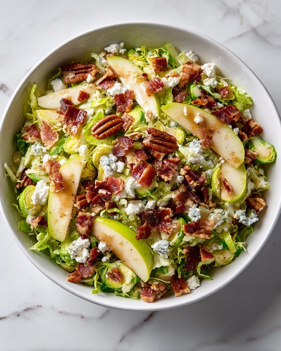 A white bowl filled with a fresh salad showing multiple layers: the bottom layer is shredded and halved bright green Brussels sprouts, topped with thin slices of yellowish-green pear wedges scattered evenly. Crispy dark brown bacon pieces are spread across the salad, mixed with medium-sized whole pecans with a rich brown color. Crumbled white feta cheese is sprinkled on top, adding a creamy texture, and there is a light drizzle of golden dressing glistening over the ingredients. The bowl rests on a white marbled textured surface. photo taken with an iphone --ar 4:5 --v 7
