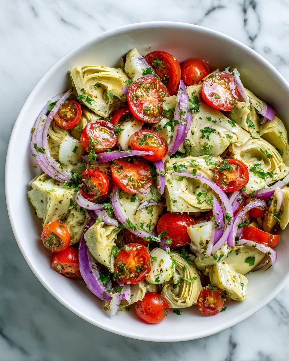 The image shows a colorful salad filled with layers of small red cherry tomatoes, pale green artichoke hearts sliced in half, and thinly sliced red onions with a slight shine. The ingredients are mixed together closely, covering the entire frame with a fresh and juicy look. The background is a white marbled surface, adding brightness to the scene. The salad appears vibrant with a mix of smooth and slightly rough textures, and small pieces of green herbs are sprinkled throughout, giving it a fresh touch. Photo taken with an iphone --ar 4:5 --v 7