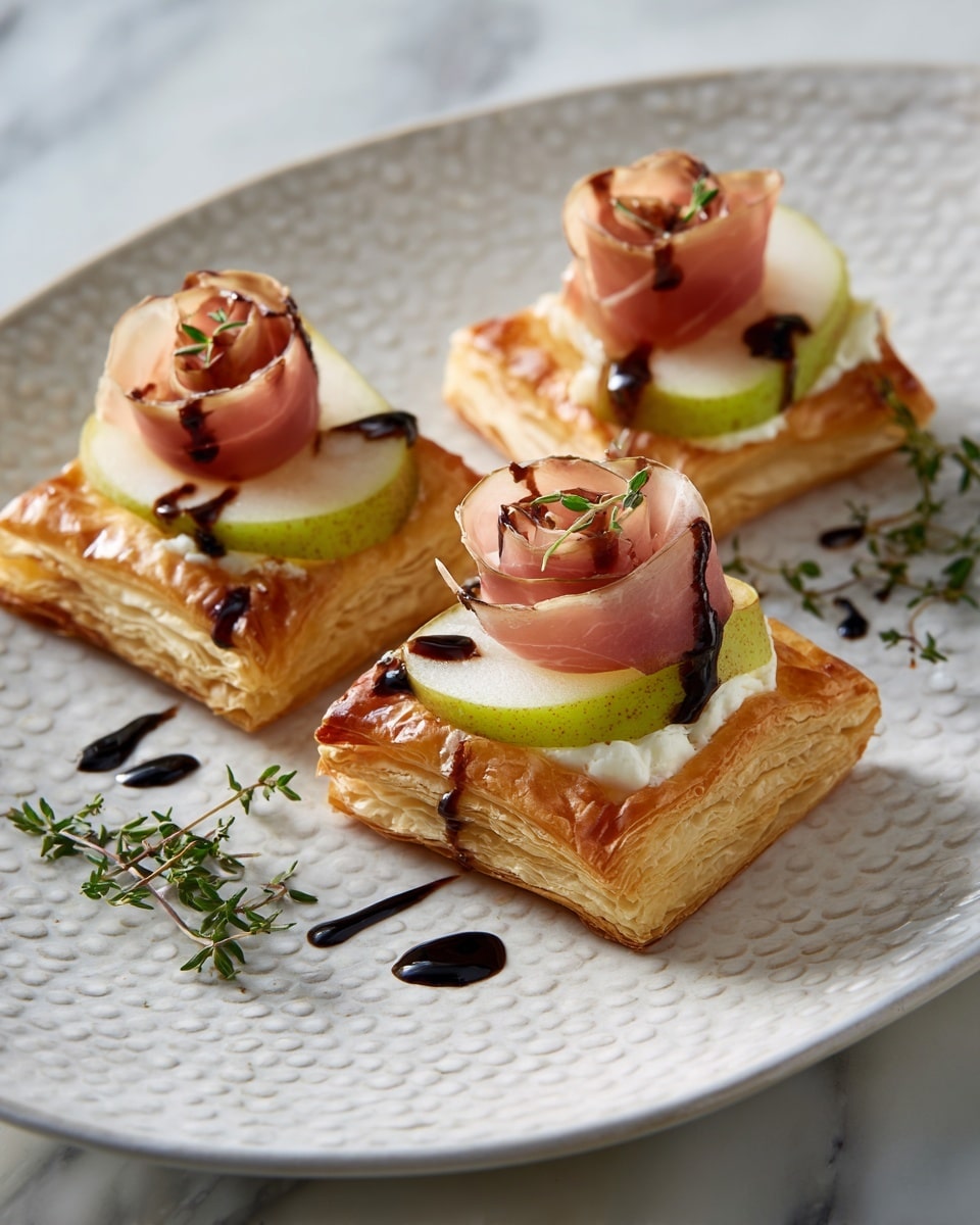 The image shows three small square puff pastry tarts with golden, flaky layers forming a raised crust. Each tart has a thick slice of green pear with a smooth texture placed on the pastry base. On top of the pear slice, there is a delicate rose-shaped layer of thinly sliced pink prosciutto. Small green thyme leaves are placed as garnish on the prosciutto and around the tarts. A dark balsamic glaze is drizzled lightly over the pears and pastry edges, adding contrast. The tarts are placed on a piece of crinkled brown parchment paper on a white plate with a raised edge, all set against a white marbled background. photo taken with an iphone --ar 4:5 --v 7