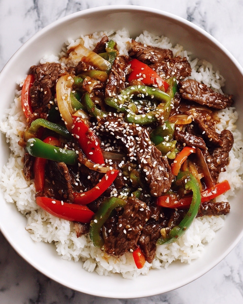 A white bowl filled with three visible layers: the bottom layer is white cooked rice with a soft, fluffy texture; the middle layer consists of bright red and green bell pepper slices and white onion pieces, adding a fresh, crisp look; the top layer has glossy, brown beef strips coated with a shiny sauce, sprinkled with light tan sesame seeds. The bowl is set on a white marbled surface with gold streaks. photo taken with an iphone --ar 4:5 --v 7