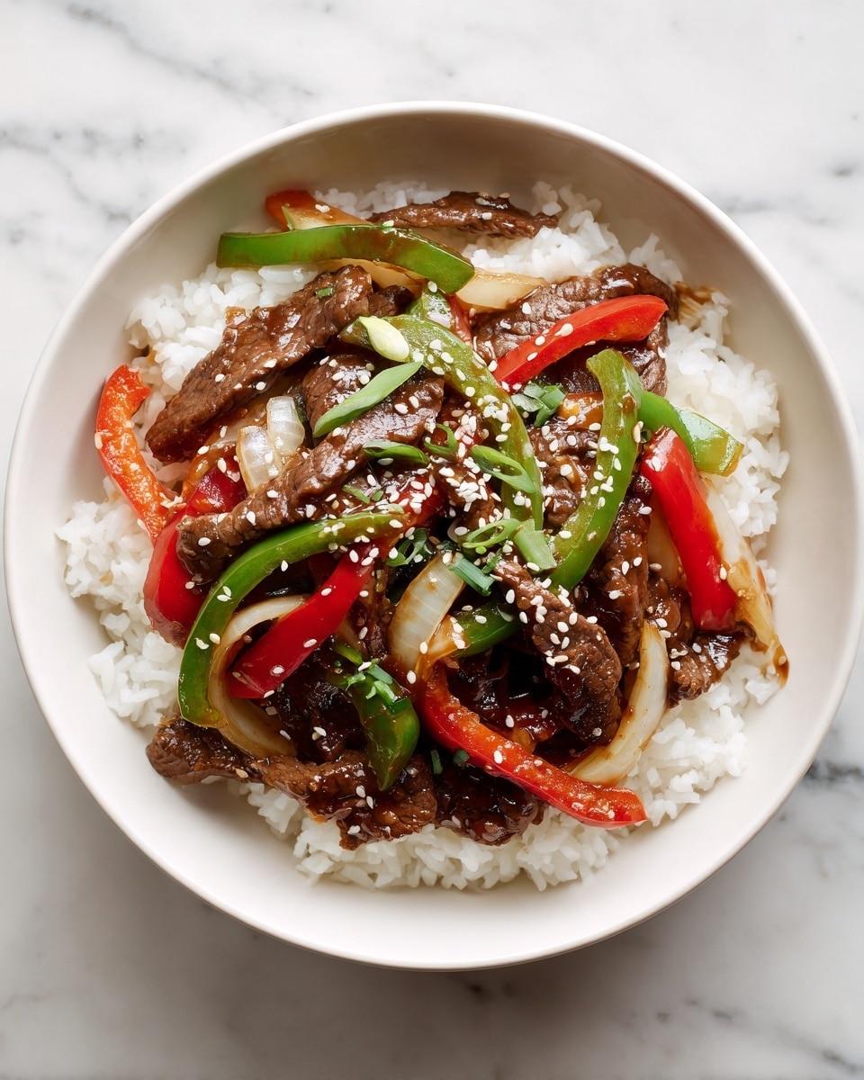 A white bowl filled with a base layer of fluffy white rice, topped with a second layer of brown beef strips covered in a glossy sauce, scattered with green and red bell pepper slices and translucent white onion slices. The beef and vegetables are sprinkled with small white sesame seeds, all sitting on a white marbled surface. photo taken with an iphone --ar 4:5 --v 7